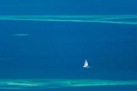 Sailboat navigating the waters of Southern Belize, with Lighthawk, Belize